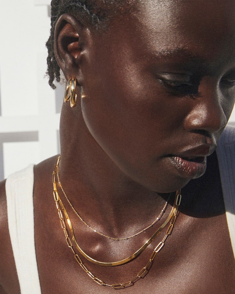 Model wearing multiple pieces of jewelry