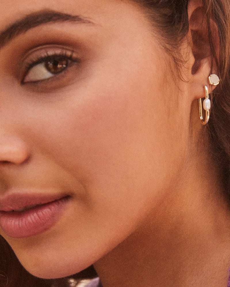 Lindsay Gold Huggie Earrings in White Pearl image number 2