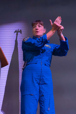 Female astronaut presenting at The Astronaut Encounter.