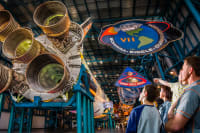 Family viewing the Saturn V on display