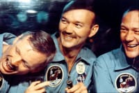 Three members of the Apollo 11 crew laughing