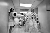 Girl holding a snoopy plushy