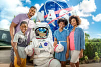 Family posing with an astronaut