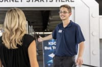 Guest services employee assisting a guest