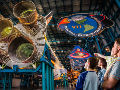 Family viewing the Saturn V on display
