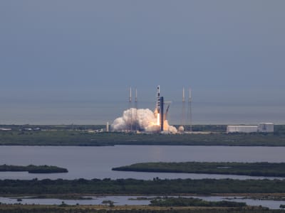 SpaceX Falcon 9 rocket with a Dragon Crew Capsule lifting off from Space Launch Complex 40 at Cape Canaveral Space Force Station in Florida.