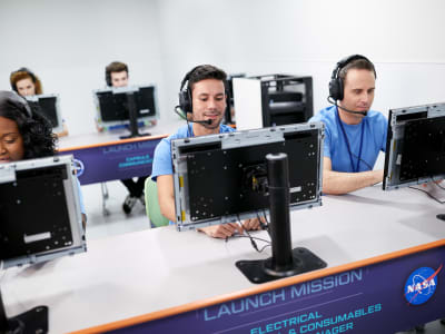 Group of students on computers at the Astronaut Training Experience