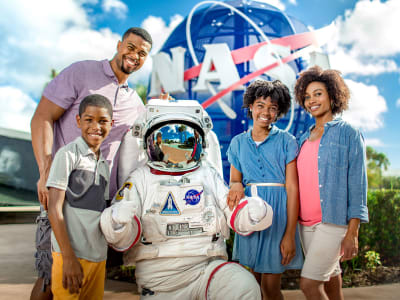 Family posing with an astronaut