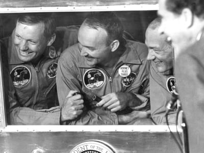Astronauts inside of a quarantine capsule