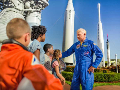 Astronaut talking to a group of children