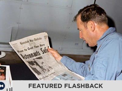 Astronaut reading about the Apollo 13 mission in the newspaper