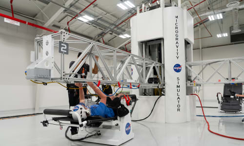 Student experiencing the microgravity attraction at the Astronaut Training Experience