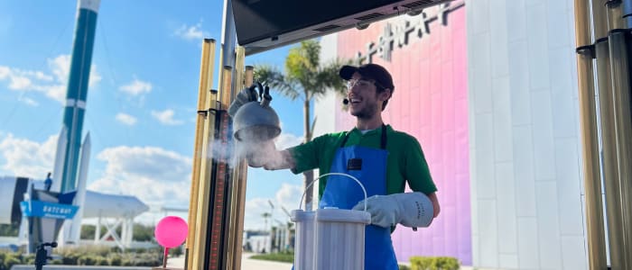 Employee giving an educational demonstration with dry ice