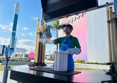 Employee presenting dry ice at a Interactive Cart