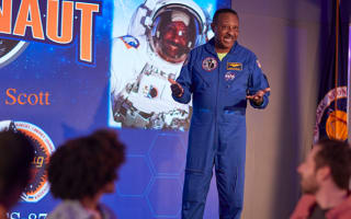 Astronaut talking to a group of visitors during Chat With An Astronaut at Kennedy Space Center
