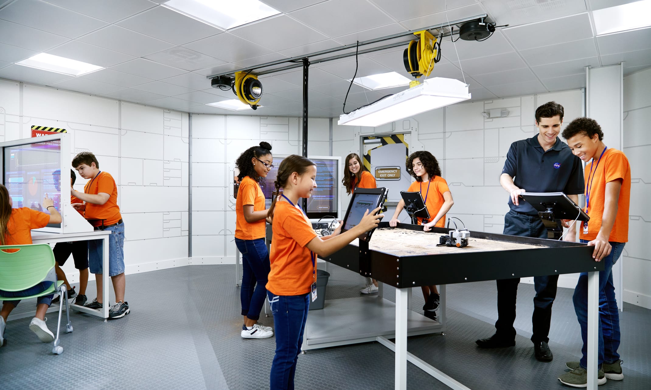 Students interacting with tablets at Camp Kennedy Space Center