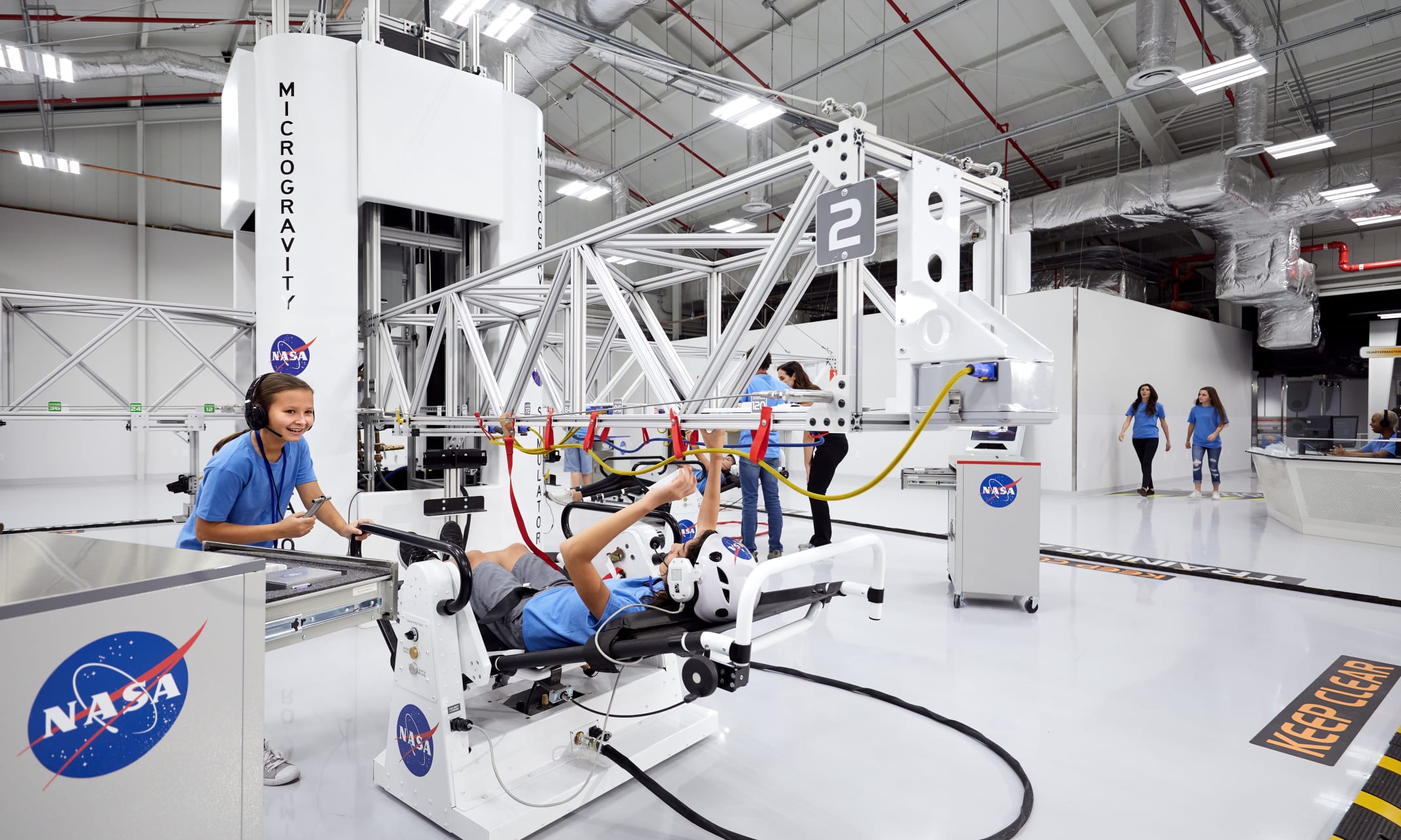 Student sitting in the Microgravity Simulator
