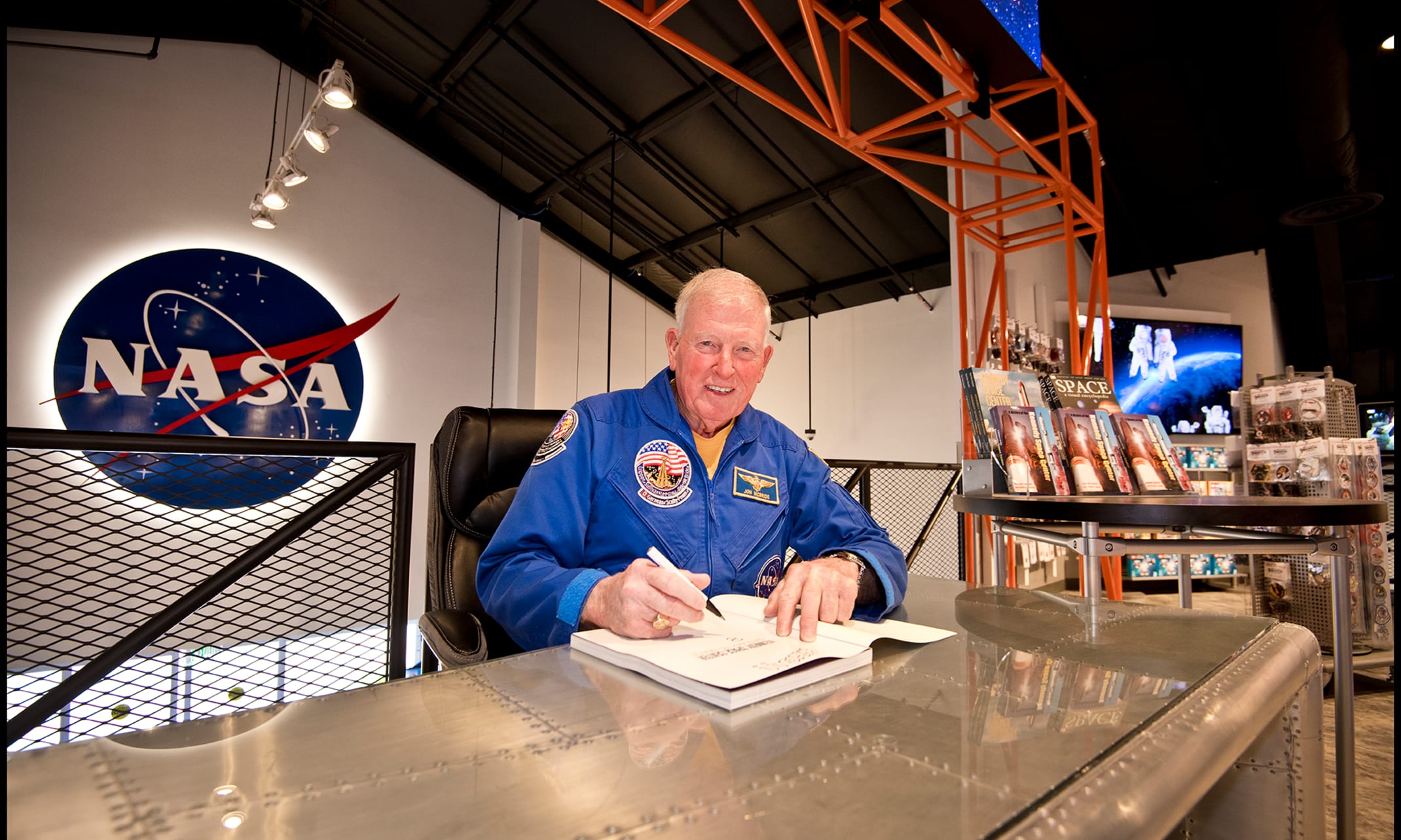 Astronaut signing an autograph