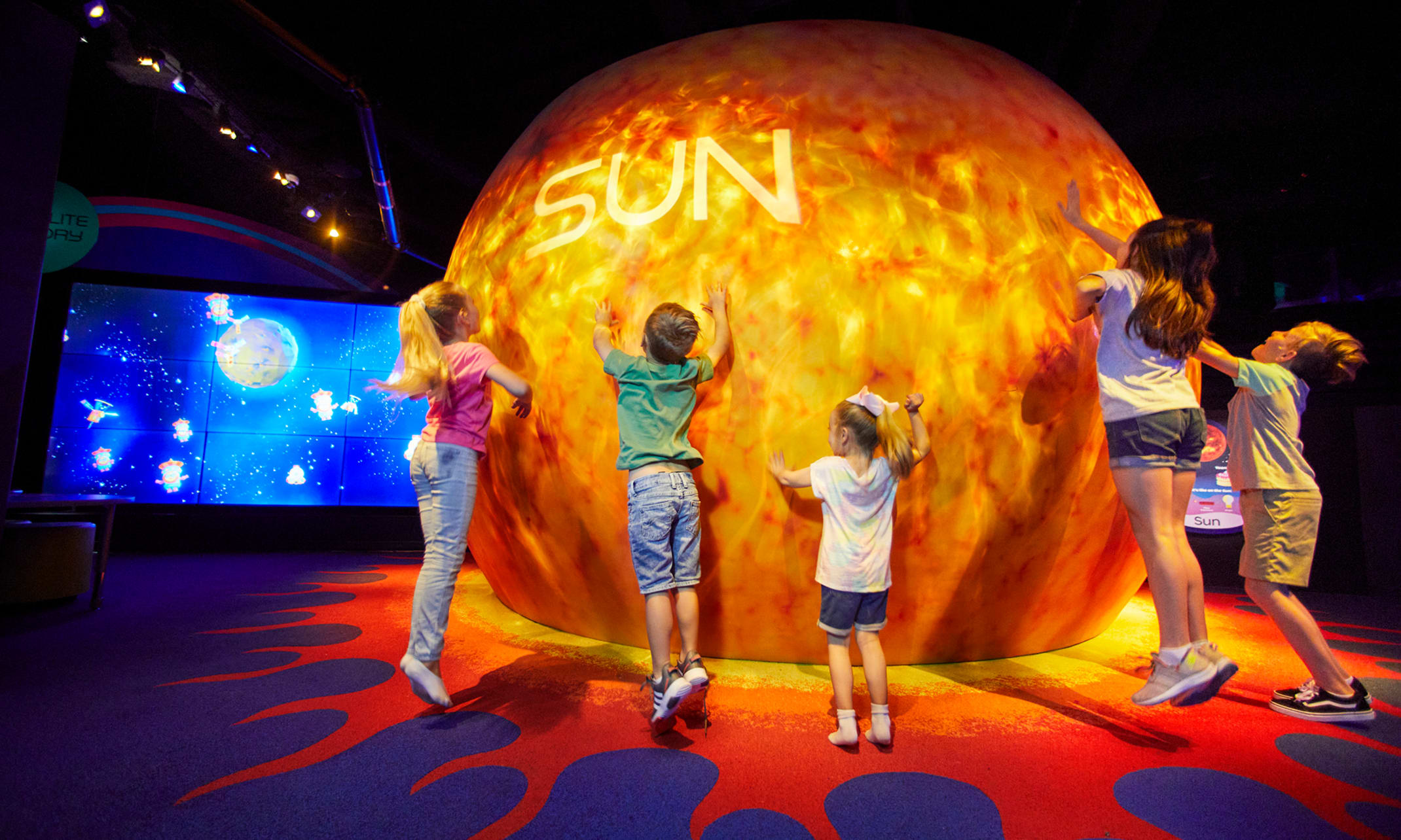 Children playing on the planets at Planet Play