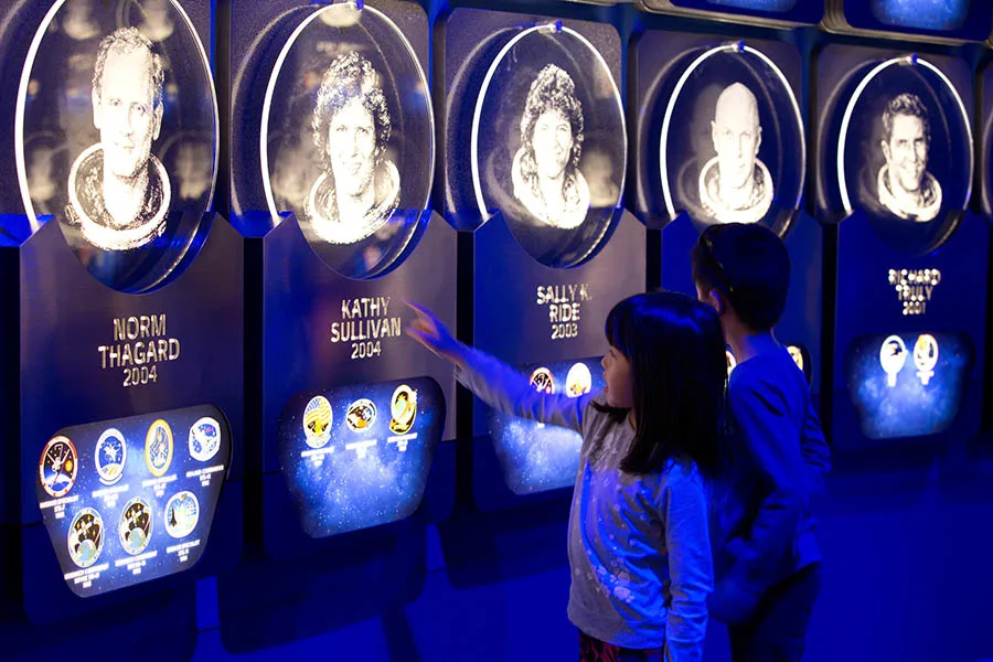Two children pointing to Kathy Sullivan's memorial