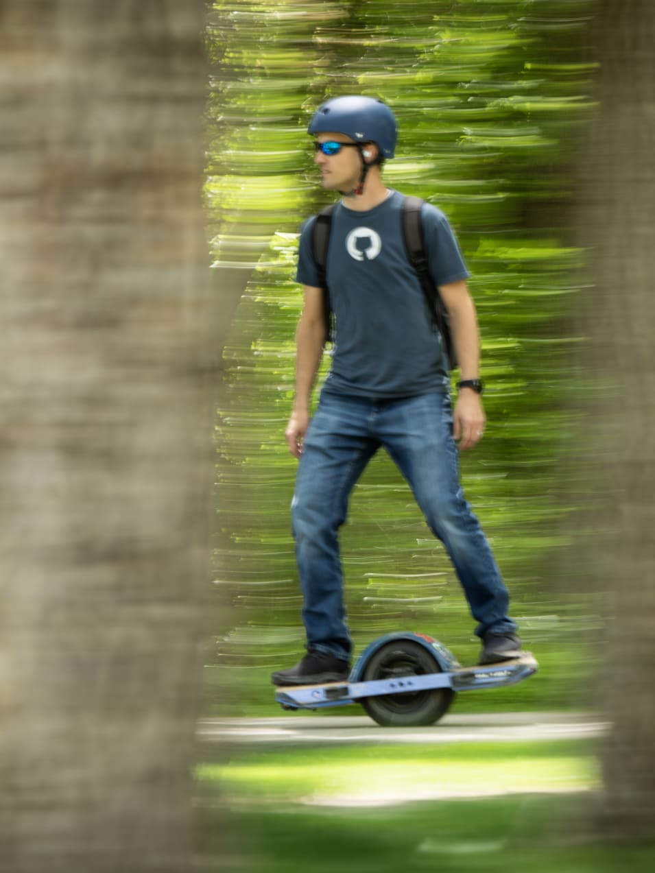 Kent riding on a onewheel in the outdoors