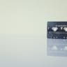 black cassette tape on white surface