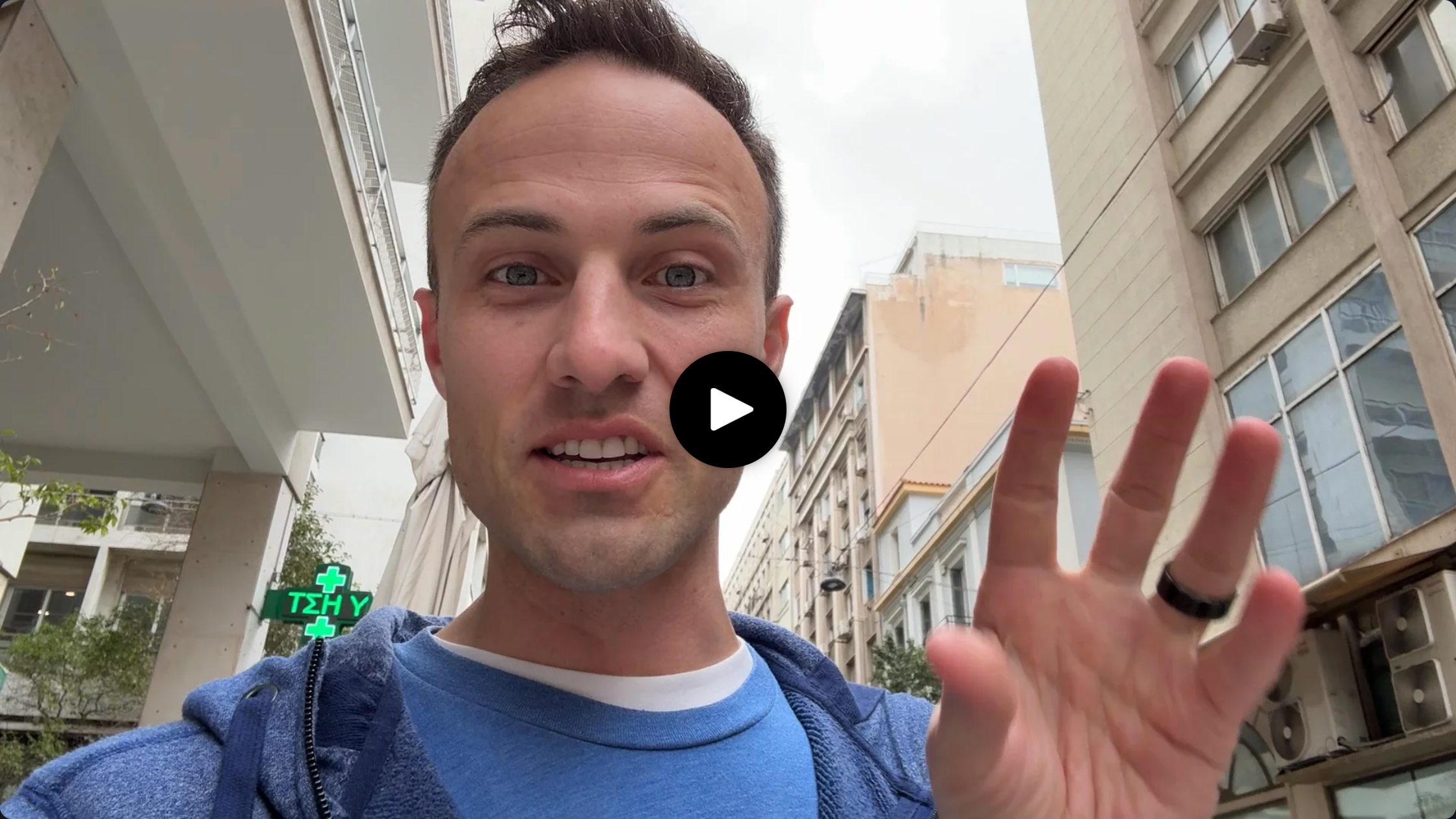 Kent waving at you with a play button over his face