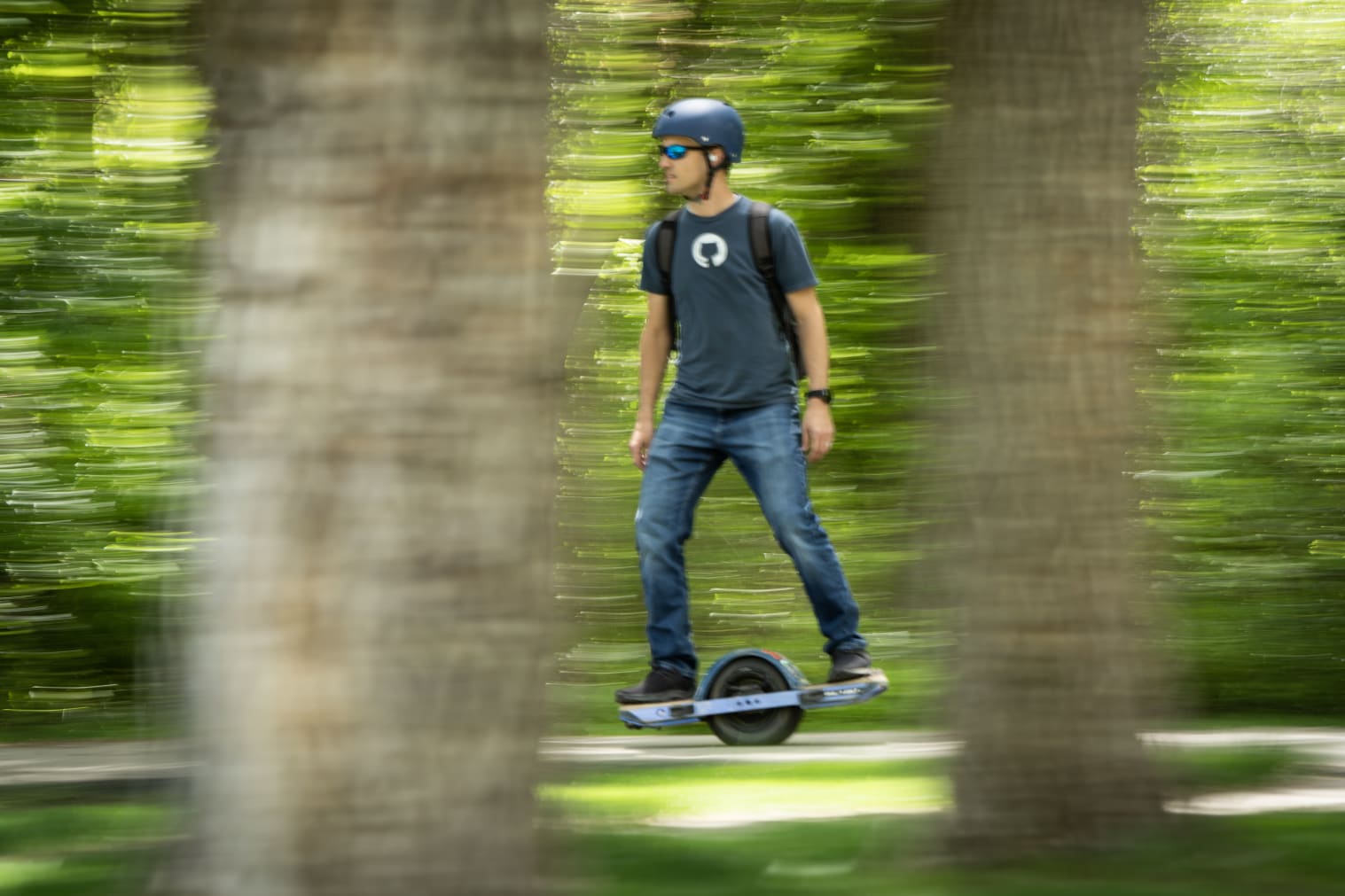 Kent riding on a onewheel in the outdoors