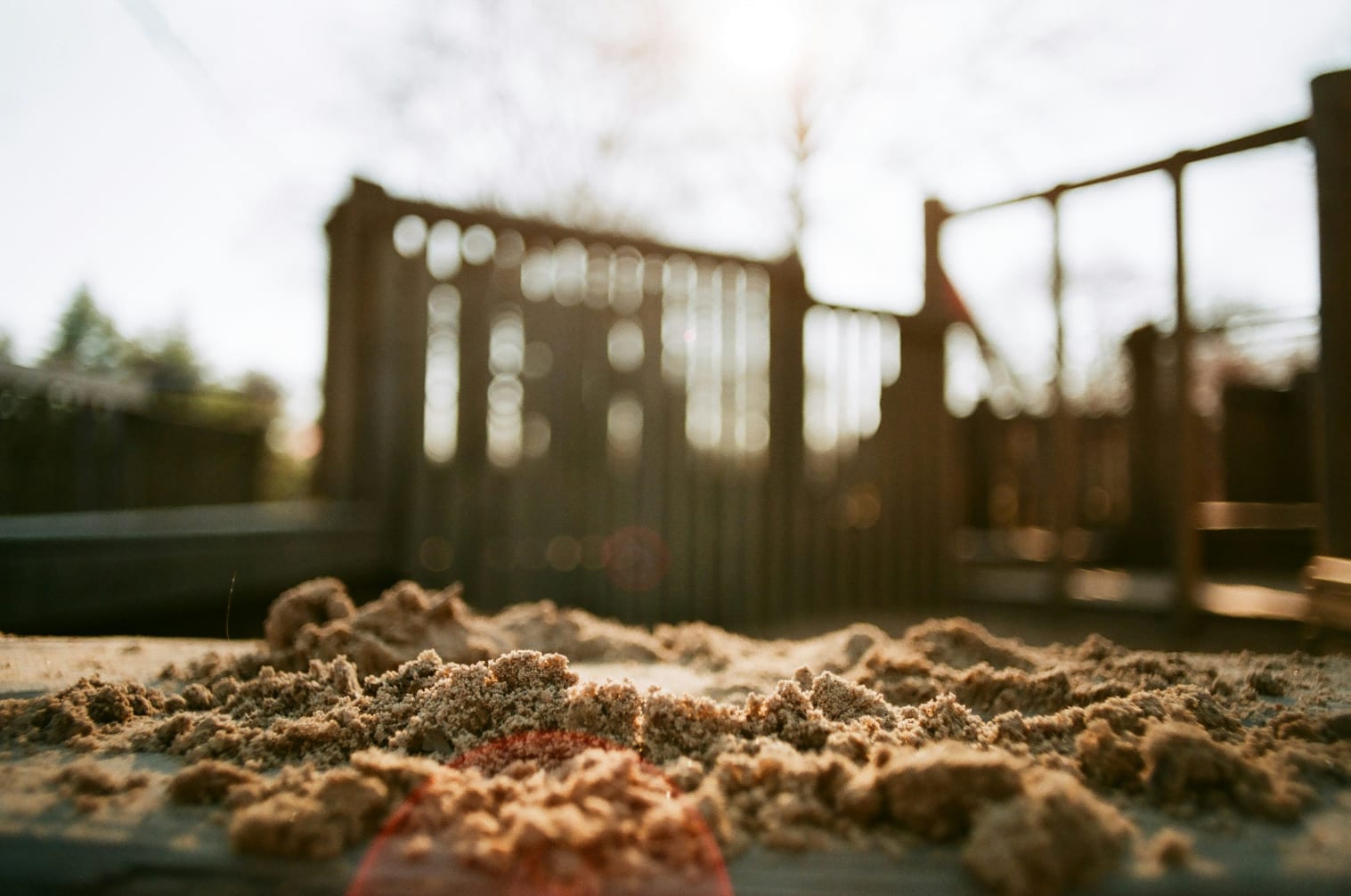 A pile of sand sitting on top of a sidewalk