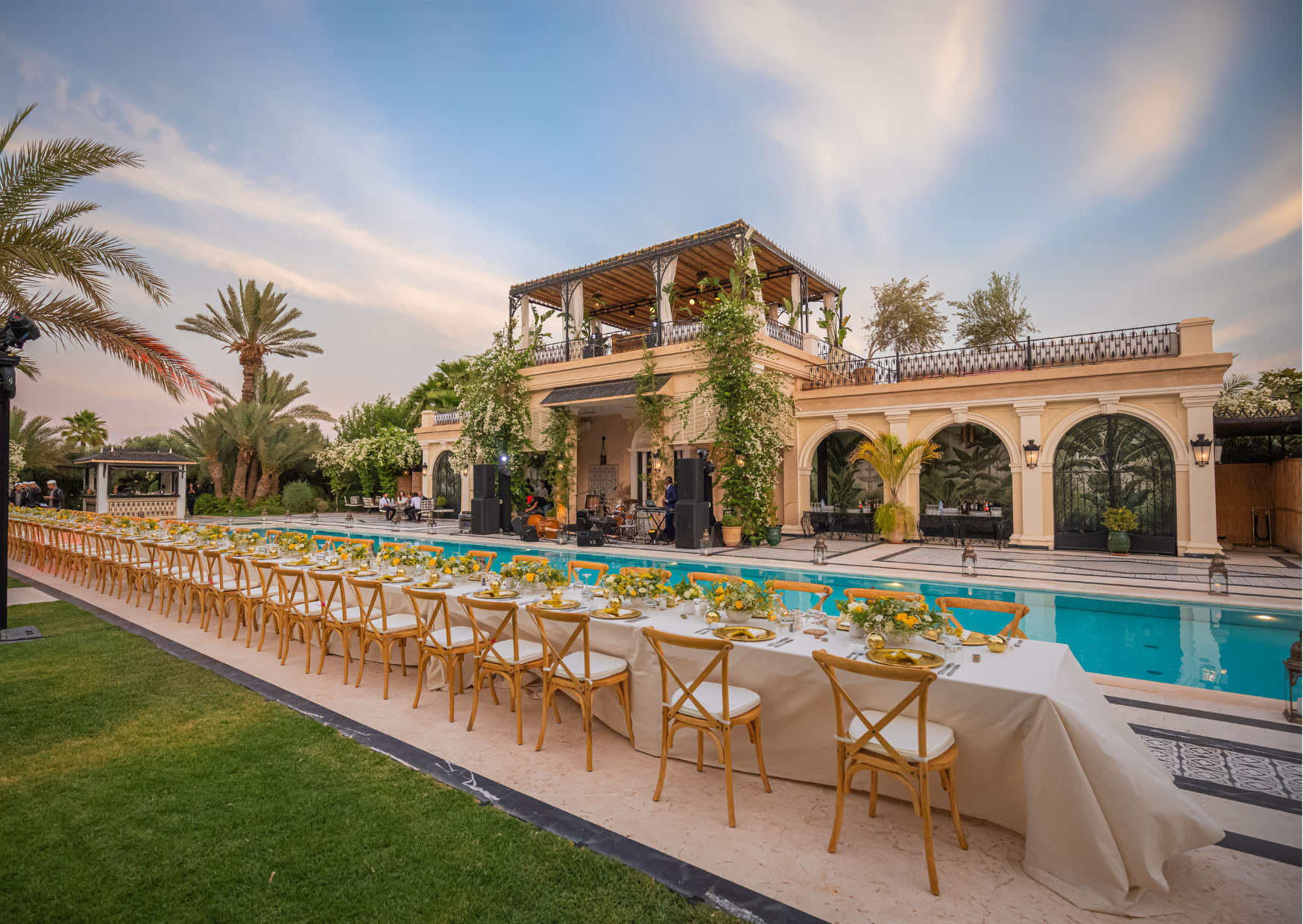 Long wedding table dressed near the pool