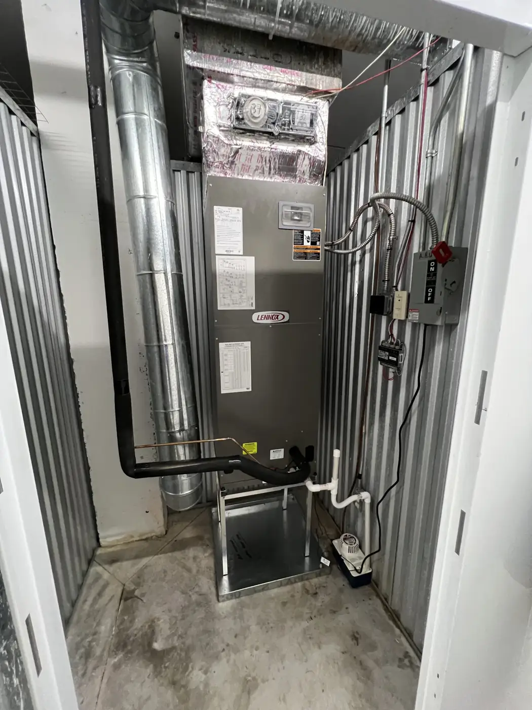HVAC technician servicing unit