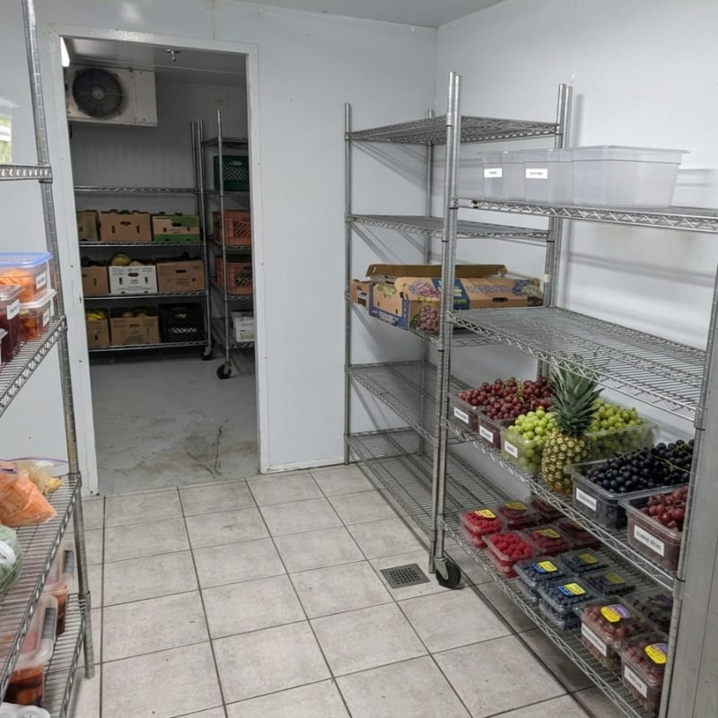 Walk-in cooler stocked with fresh produce