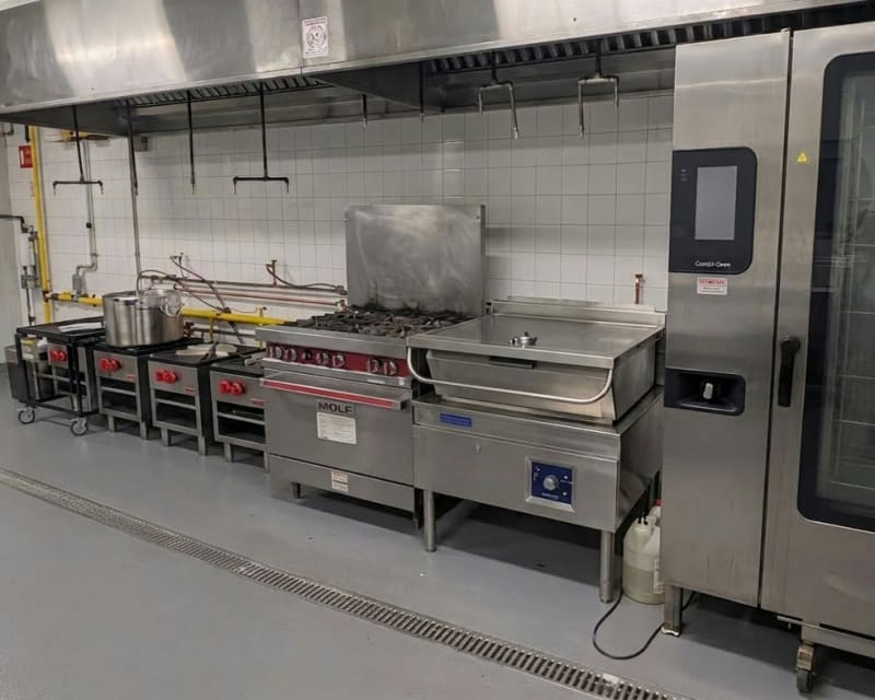 MiFoodStudio cook line, angled view of the full six-station line