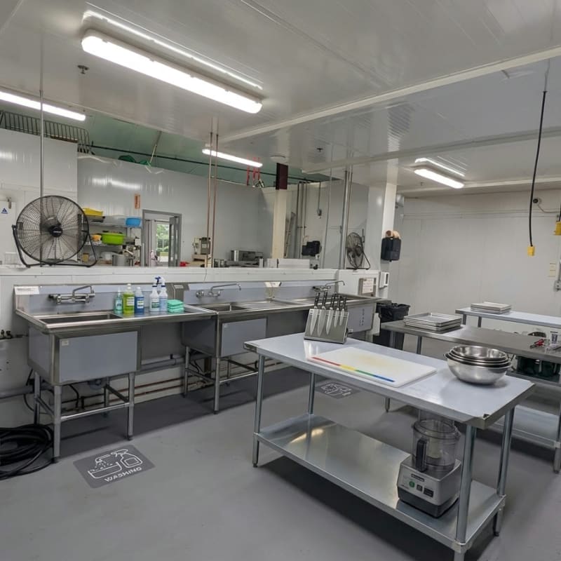 Stainless steel prep area with worktables