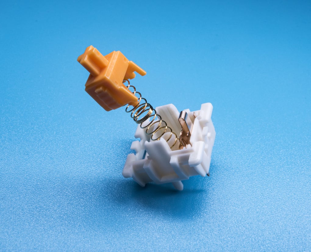 Tbcats Eclair Orange Linear Switches opened to show internals