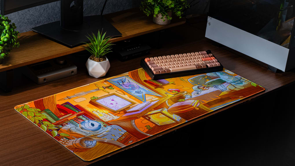 Whimsical Abode Daytime Desk Mat on Wooden Desk