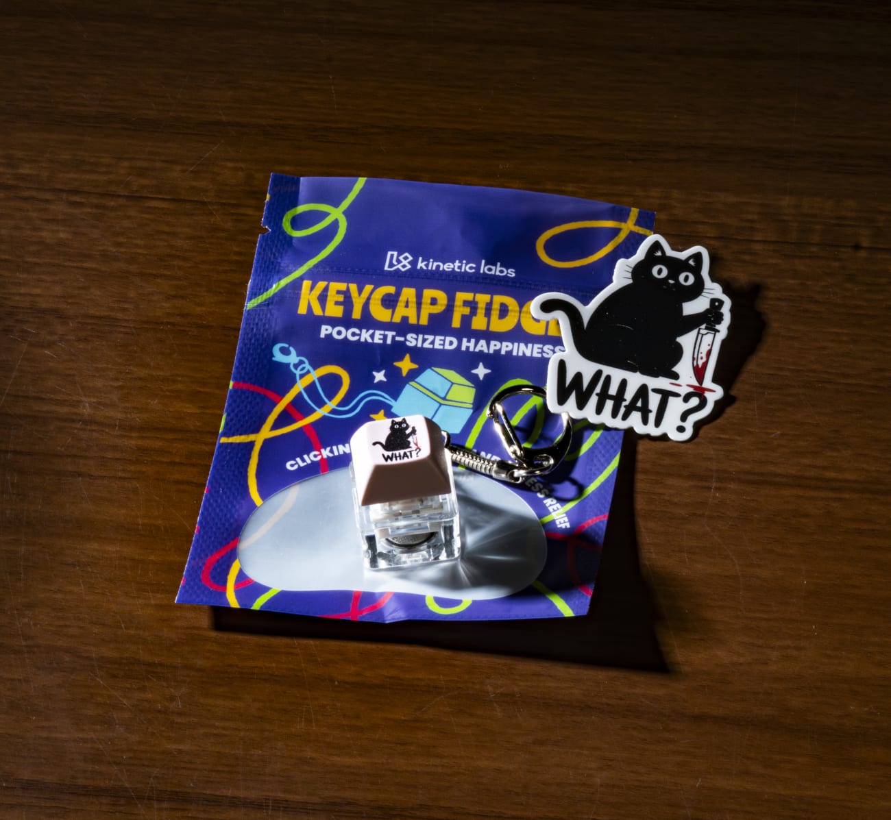 Funny Keycap Fidget - Shown with packaging and sticker