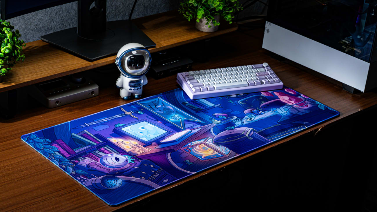 Whimsical Abode Nighttime Desk Mat on Desk with Astronaut Toy