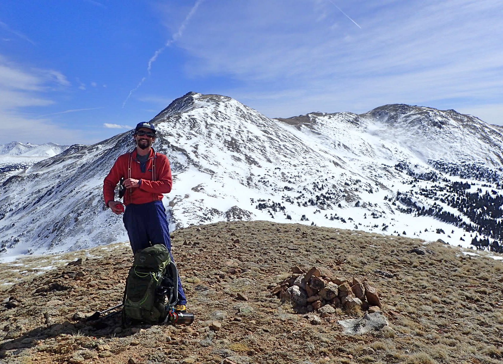 Photo of Connor standing on an unnamed peak in Colorodo
