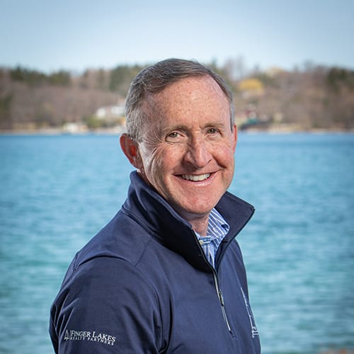 ARITAE CEO and Chief Inspirational Officer Jerry Morrissey posing for his realty company head shot.
