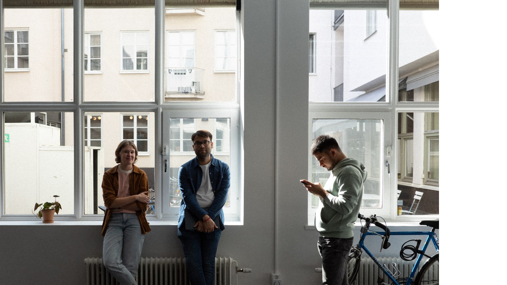 An image of 3 Kisi employees in Kisi's Stockholm office during hack week