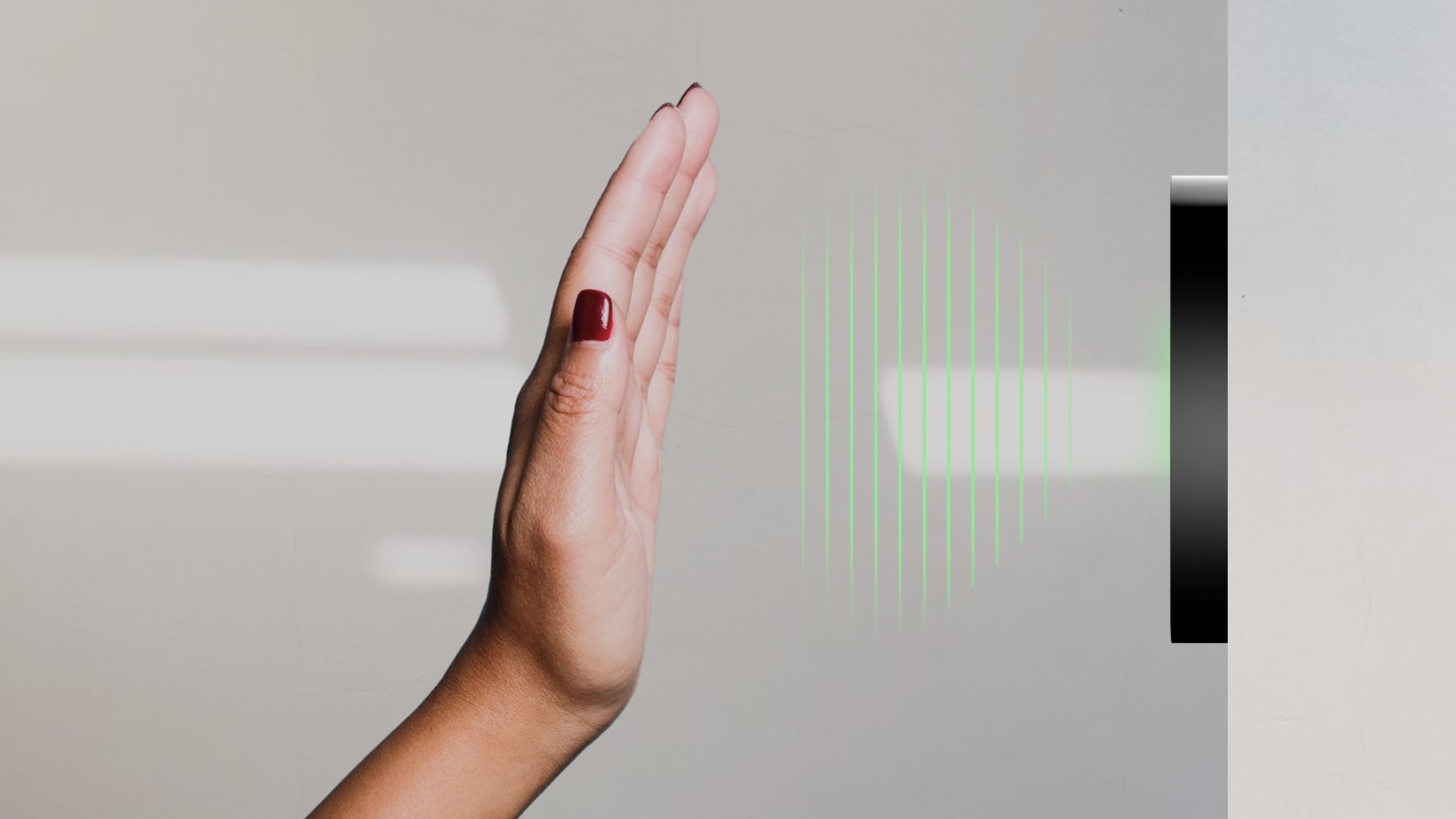 An image showing a hand waving in front of a Kisi reader to unlock a door with a contactless MotionSense technology