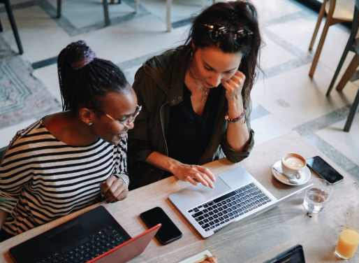 Two women at a coworking space talking