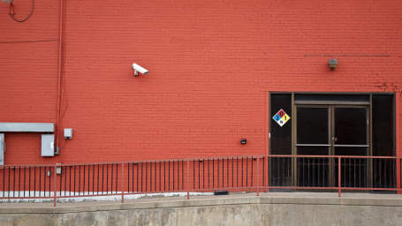 security camera in front of a business entrance