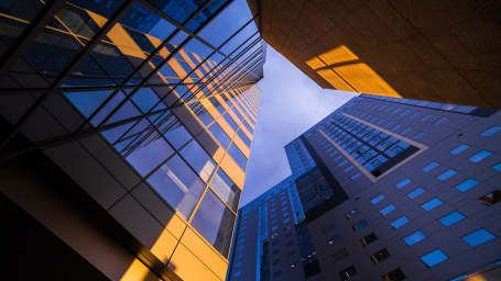 An image showing high commercial real estate buildings 