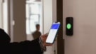 Person using a mobile door entry system for a coworking place