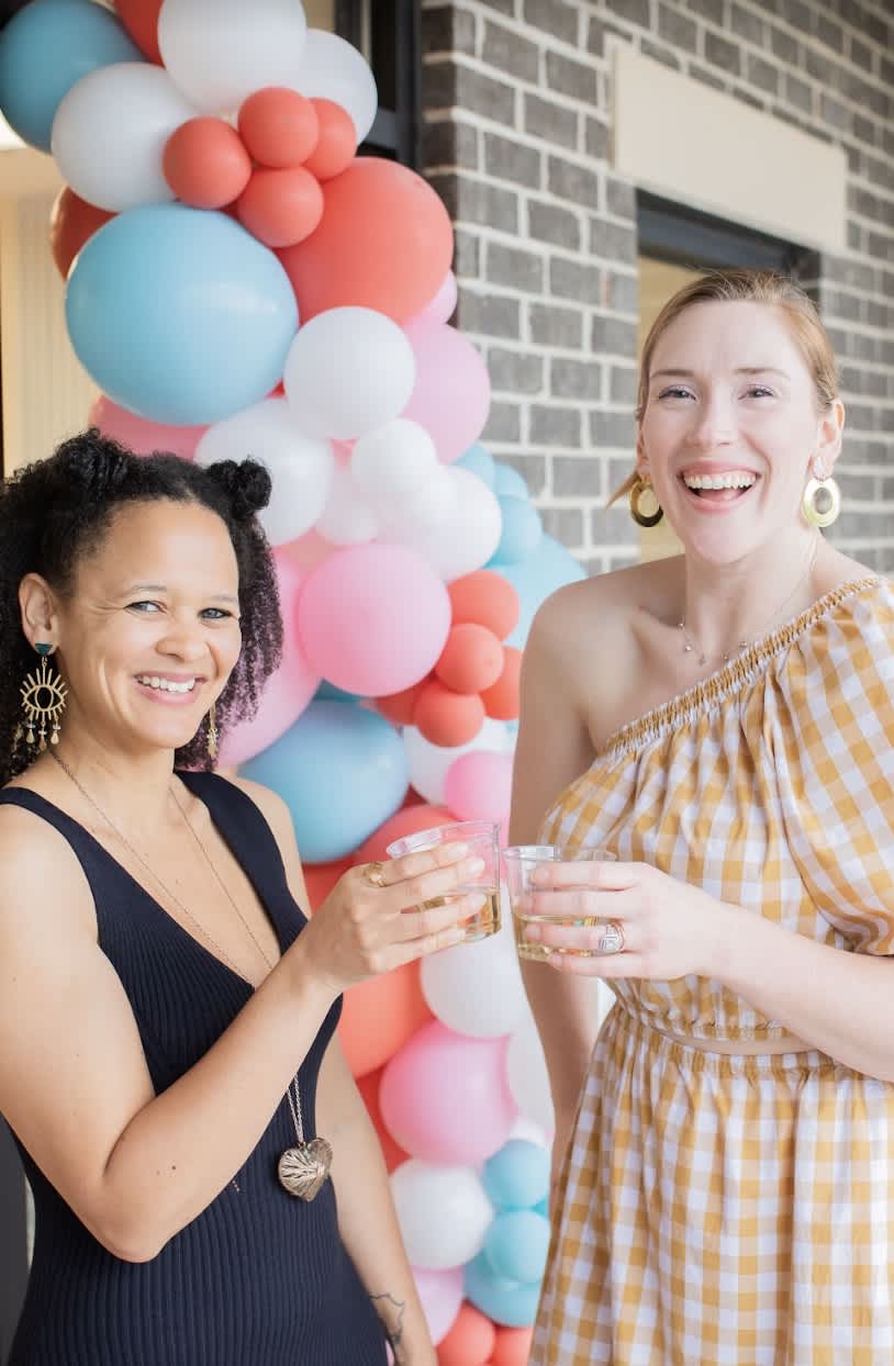 A photo of The Collab's founders, Emma and Fabi celebrating the opening of the coworking space