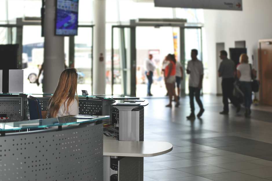 Reception desk at a busy company entrance