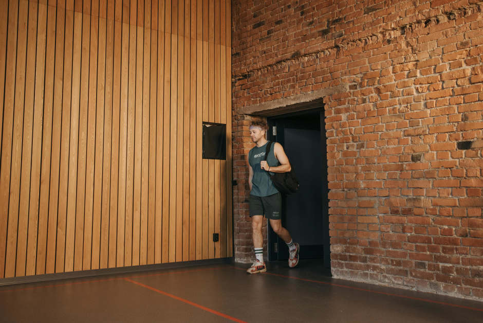Person walking into a gym