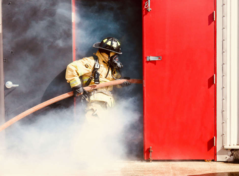 firefighter entering a fail safe door